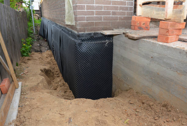 Happy homeowners after waterproofing job in Oakley